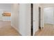Hallway leading to bedrooms, bathrooms and kitchen area of the house with a walk-in pantry at 1047 Amber Gate St, Henderson, NV 89002