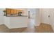 Open-concept kitchen with wooden cabinets, granite countertops, and easy access to the entryway at 1047 Amber Gate St, Henderson, NV 89002