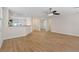 Open-concept living space with wood floors, seamlessly connecting living room and kitchen at 1047 Amber Gate St, Henderson, NV 89002