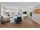 Spacious living room features wood floors, recessed lighting, ceiling fan and sliding glass door to patio at 1047 Amber Gate St, Henderson, NV 89002