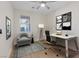 Bright home office featuring sleek desk, comfortable chair, stylish decor, and a window for natural light at 1047 Amber Gate St, Henderson, NV 89002
