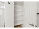 Bright white pantry features multiple shelves for ample storage space and easy organization at 1047 Amber Gate St, Henderson, NV 89002