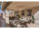 Relaxing covered patio with comfortable seating, ceiling fans, and neutral tones for outdoor enjoyment at 1047 Amber Gate St, Henderson, NV 89002