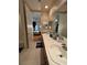 Bathroom with double sinks, a bathtub, and plenty of space at 10657 San Vercelli Ct, Las Vegas, NV 89141