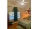 Comfortable bedroom with hardwood floors, bed, dresser, and window with blinds at 10657 San Vercelli Ct, Las Vegas, NV 89141