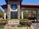 Elegant entrance to The Foothills community with stone accents and manicured landscaping at 10657 San Vercelli Ct, Las Vegas, NV 89141