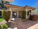 Inviting home with a front entrance with tiled entry and manicured landscaping at 10657 San Vercelli Ct, Las Vegas, NV 89141