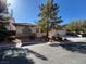 Charming single-story home with well-maintained landscaping and a cozy front porch at 10657 San Vercelli Ct, Las Vegas, NV 89141
