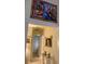Inviting hallway showcasing elegant decor, artwork, and a glimpse into other rooms at 10657 San Vercelli Ct, Las Vegas, NV 89141