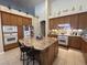Kitchen with an island and wooden cabinets, displaying decor and ample counter space at 10657 San Vercelli Ct, Las Vegas, NV 89141