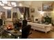 Elegant living room with beautiful chandeliers, artwork, and sophisticated decor at 10657 San Vercelli Ct, Las Vegas, NV 89141