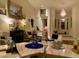 Elegant living room featuring high ceilings, artwork, and stylish furniture at 10657 San Vercelli Ct, Las Vegas, NV 89141