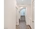 Hallway with wood-look flooring leading to a staircase and additional rooms at 10806 Space Odyssey Ave, Las Vegas, NV 89129