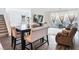 Open-concept living and dining area with stylish furniture and access to outdoor patio at 10806 Space Odyssey Ave, Las Vegas, NV 89129