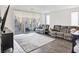Comfortable living area with large sliding doors to a balcony offering ample seating at 10806 Space Odyssey Ave, Las Vegas, NV 89129