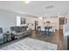 Inviting living space with a comfortable couch and an open view of the kitchen and dining area at 10806 Space Odyssey Ave, Las Vegas, NV 89129