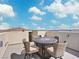 This rooftop deck features an outdoor dining set and offers breathtaking views of the surrounding area at 10806 Space Odyssey Ave, Las Vegas, NV 89129