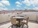 Enjoy rooftop living with a table and chairs for outdoor entertaining, with a mountain view at 10806 Space Odyssey Ave, Las Vegas, NV 89129