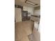Incomplete kitchen renovation with new tile flooring and partially finished walls at 116 Continental Ave, Henderson, NV 89015