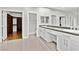 Bathroom with double vanity, modern fixtures, and walk in closet at 133 S Buteo Woods Ln, Las Vegas, NV 89144