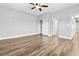 Bedroom with wood floors, closet, and neutral finishes at 133 S Buteo Woods Ln, Las Vegas, NV 89144