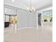 Open dining room with view of the living area and backyard access at 133 S Buteo Woods Ln, Las Vegas, NV 89144
