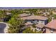 Well maintained two-story home featuring desert landscaping, a tile roof, and an attached three-car garage at 133 S Buteo Woods Ln, Las Vegas, NV 89144
