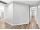 Spacious hallway with wood-style flooring and neutral paint at 133 S Buteo Woods Ln, Las Vegas, NV 89144