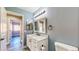 Bathroom with marble countertop vanity and wood-look floors at 1532 Ascension Cir, North Las Vegas, NV 89031