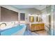Bathroom with freestanding tub, marble vanity, and glass shower at 1532 Ascension Cir, North Las Vegas, NV 89031