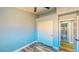 Simple bedroom featuring wood-look floors, a closet, and doorway leading to the bathroom at 1532 Ascension Cir, North Las Vegas, NV 89031
