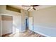 This bedroom features light gray walls, wood flooring, and closet storage space at 1532 Ascension Cir, North Las Vegas, NV 89031