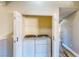 Convenient laundry closet with open doors at 1532 Ascension Cir, North Las Vegas, NV 89031