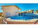 Backyard pool with concrete edging and desert landscaping at 1532 Ascension Cir, North Las Vegas, NV 89031