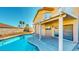 Backyard pool area with covered patio and desert landscaping at 1532 Ascension Cir, North Las Vegas, NV 89031