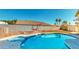 Backyard swimming pool with an in-ground hot tub and desert landscaping at 1532 Ascension Cir, North Las Vegas, NV 89031