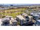 Aerial view of modern homes near a park and highway, showcasing the community's location and amenities at 1536 Unison Way # 102, Las Vegas, NV 89135