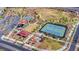 Aerial view of community park featuring tennis courts, playgrounds, and green space at 1536 Unison Way # 102, Las Vegas, NV 89135