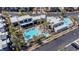 Aerial view of community pool area with lounge chairs and modern architecture at 1536 Unison Way # 102, Las Vegas, NV 89135