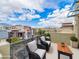 Private balcony with comfortable seating offering views of the neighborhood at 1536 Unison Way # 102, Las Vegas, NV 89135
