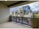 Private balcony with a view of the neighboring townhomes and landscaping at 1536 Unison Way # 102, Las Vegas, NV 89135