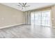 Bright bedroom with tile floors, sheer curtains, and large window at 1536 Unison Way # 102, Las Vegas, NV 89135