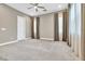 Bedroom with soft carpet, large windows with curtains, and a neutral color palette for a relaxing atmosphere at 1536 Unison Way # 102, Las Vegas, NV 89135