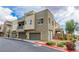 Modern townhome with desert landscaping and a private garage on a sunny day at 1536 Unison Way # 102, Las Vegas, NV 89135