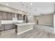 Open kitchen with stainless steel appliances, a central island, and modern cabinetry at 1536 Unison Way # 102, Las Vegas, NV 89135