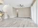 Open and airy living area with tile flooring, neutral walls, and a stairway leading to the second level at 1536 Unison Way # 102, Las Vegas, NV 89135