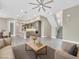 Open living area featuring modern gray kitchen, dining area and staircase at 1536 Unison Way # 102, Las Vegas, NV 89135