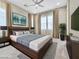 Serene main bedroom featuring modern furniture, soft lighting, and stylish decor at 1536 Unison Way # 102, Las Vegas, NV 89135