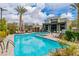 Community pool and lounge area with clear blue water and comfortable seating at 1536 Unison Way # 102, Las Vegas, NV 89135