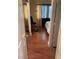 Cozy bedroom featuring wood floors, window with curtains, and a comfortable chair at 1800 Edmond St # 213, Las Vegas, NV 89146